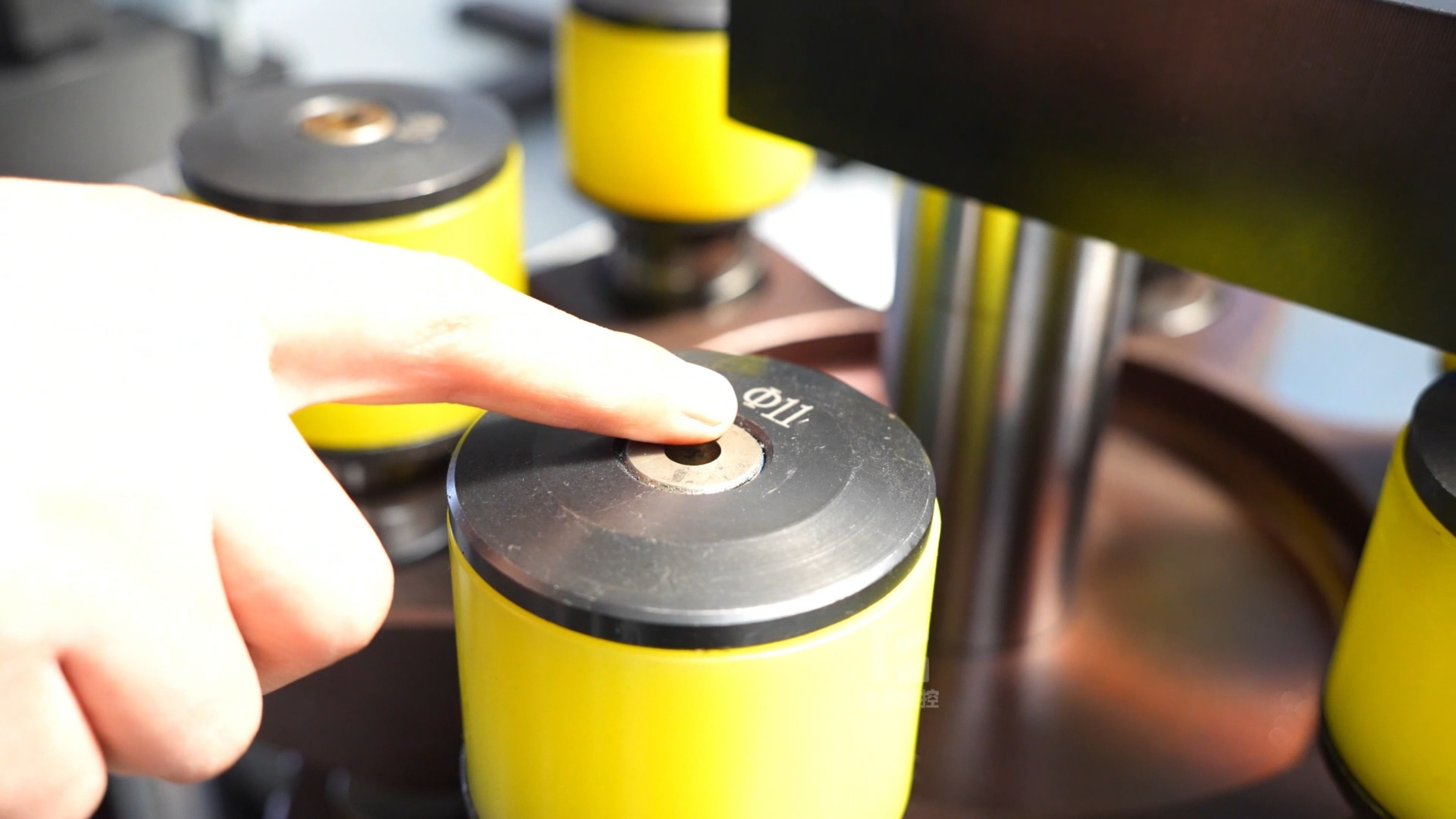 Busbar punching machine featuring a turret design, capable of holding six sets of dies simultaneously.